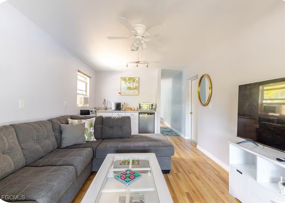 3315 Franzone Road St. James City, FL 33956 - Photo 24 of 37 a living room with furniture and a flat screen tv