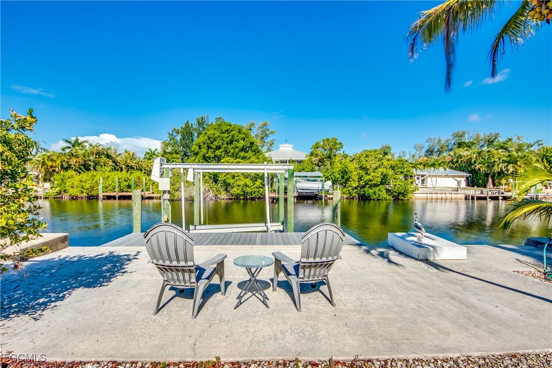 3315 Franzone Road St. James City, FL 33956 - Photo 33 of 37 a view of a chairs and table in patio