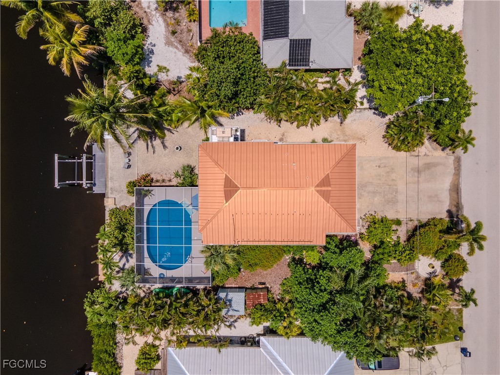 3315 Franzone Road St. James City, FL 33956 - Photo 4 of 37 an aerial view of a house with garden space and outdoor seating