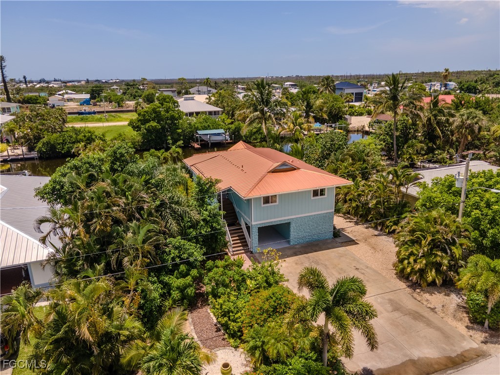 3315 Franzone Road St. James City, FL 33956 - Photo 5 of 37 an aerial view of a house with a yard and lake view