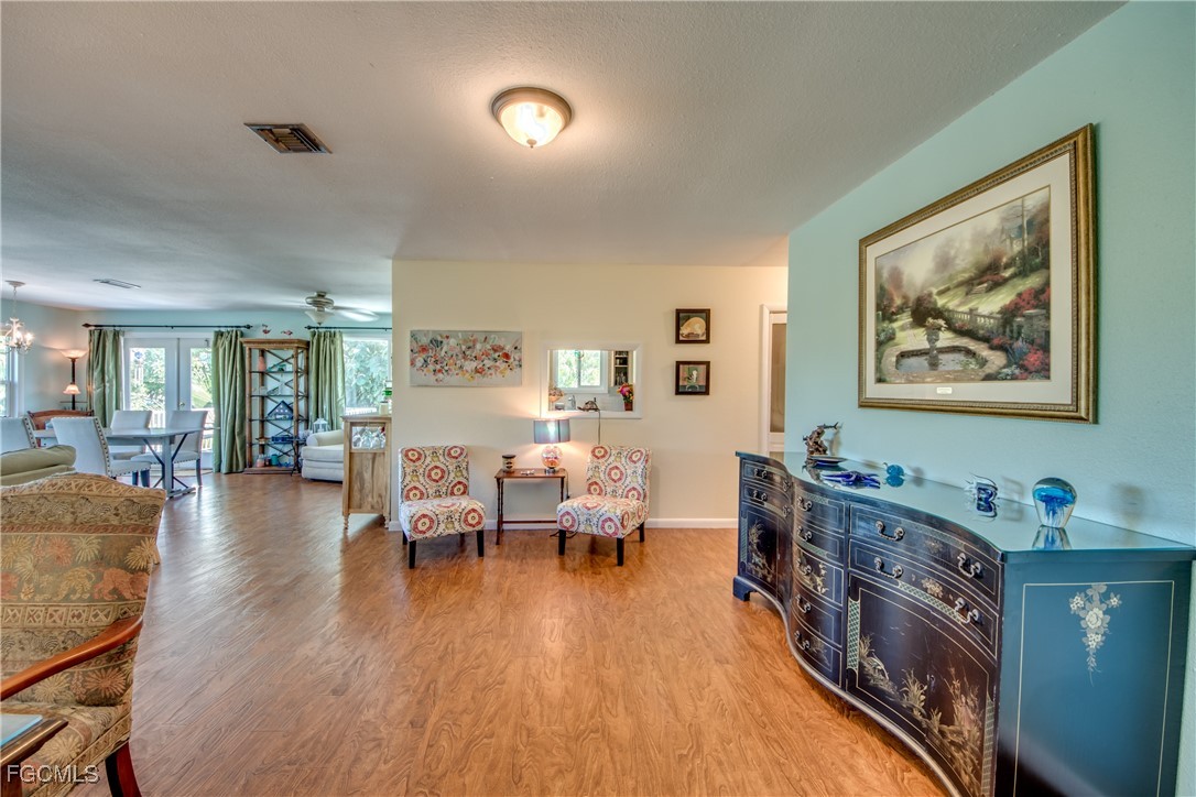 3315 Franzone Road St. James City, FL 33956 - Photo 6 of 37 a living room with furniture and a wooden floor
