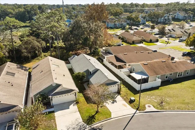 an aerial view of a house with a swimming pool