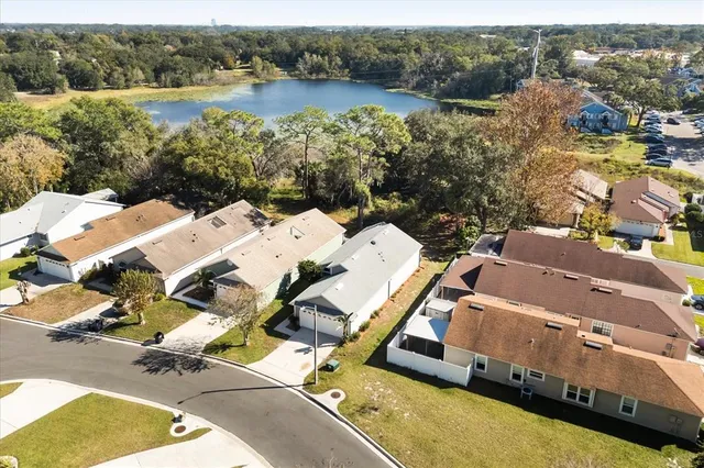 an aerial view of a house with a lake view
