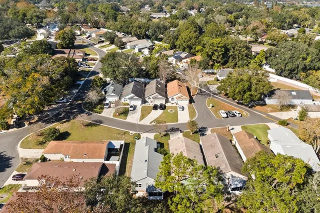 an aerial view of a house with yard swimming pool and outdoor seating