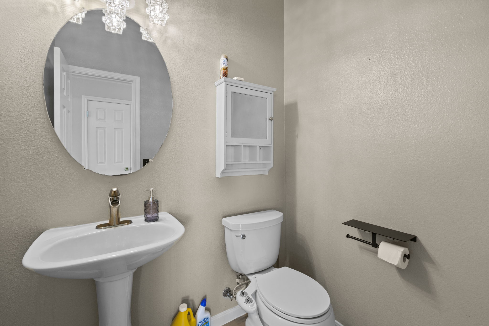 1100 Vanderbilt Circle Pflugerville, TX 78660 - Photo 16 of 39 a bathroom with a toilet a sink and mirror