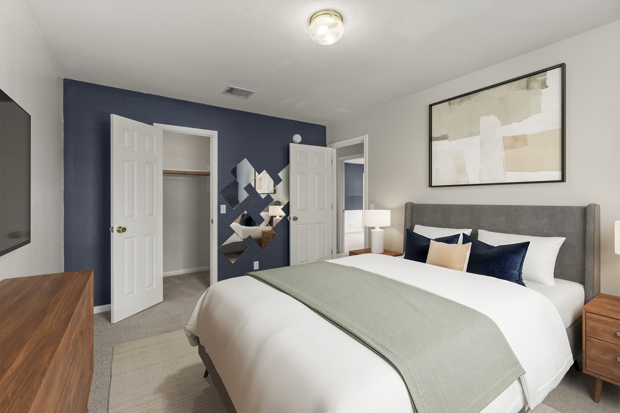 1100 Vanderbilt Circle Pflugerville, TX 78660 - Photo 20 of 39 a bedroom with a bed and a large mirror