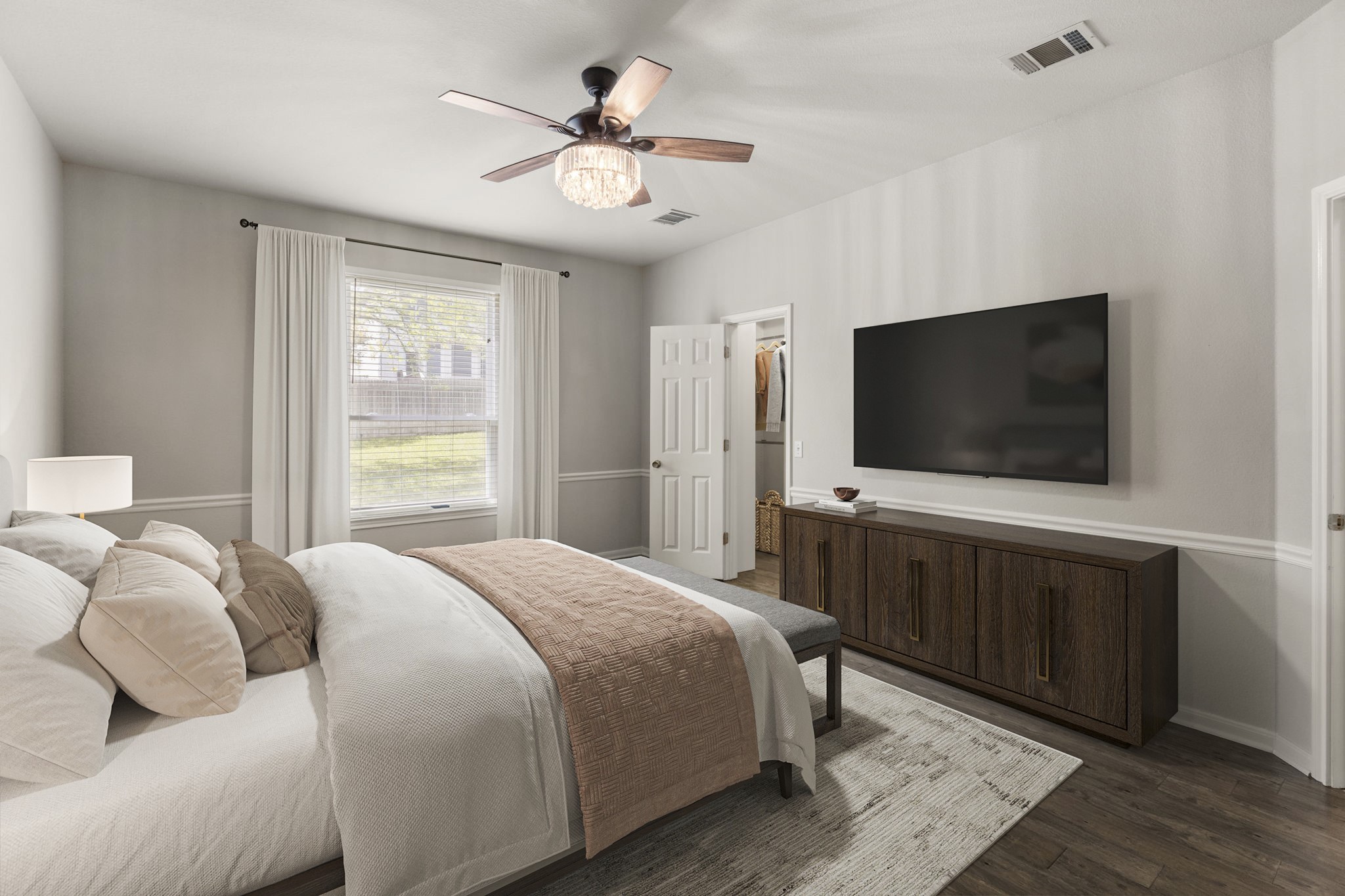1100 Vanderbilt Circle Pflugerville, TX 78660 - Photo 24 of 39 a bedroom with a bed and a flat screen tv