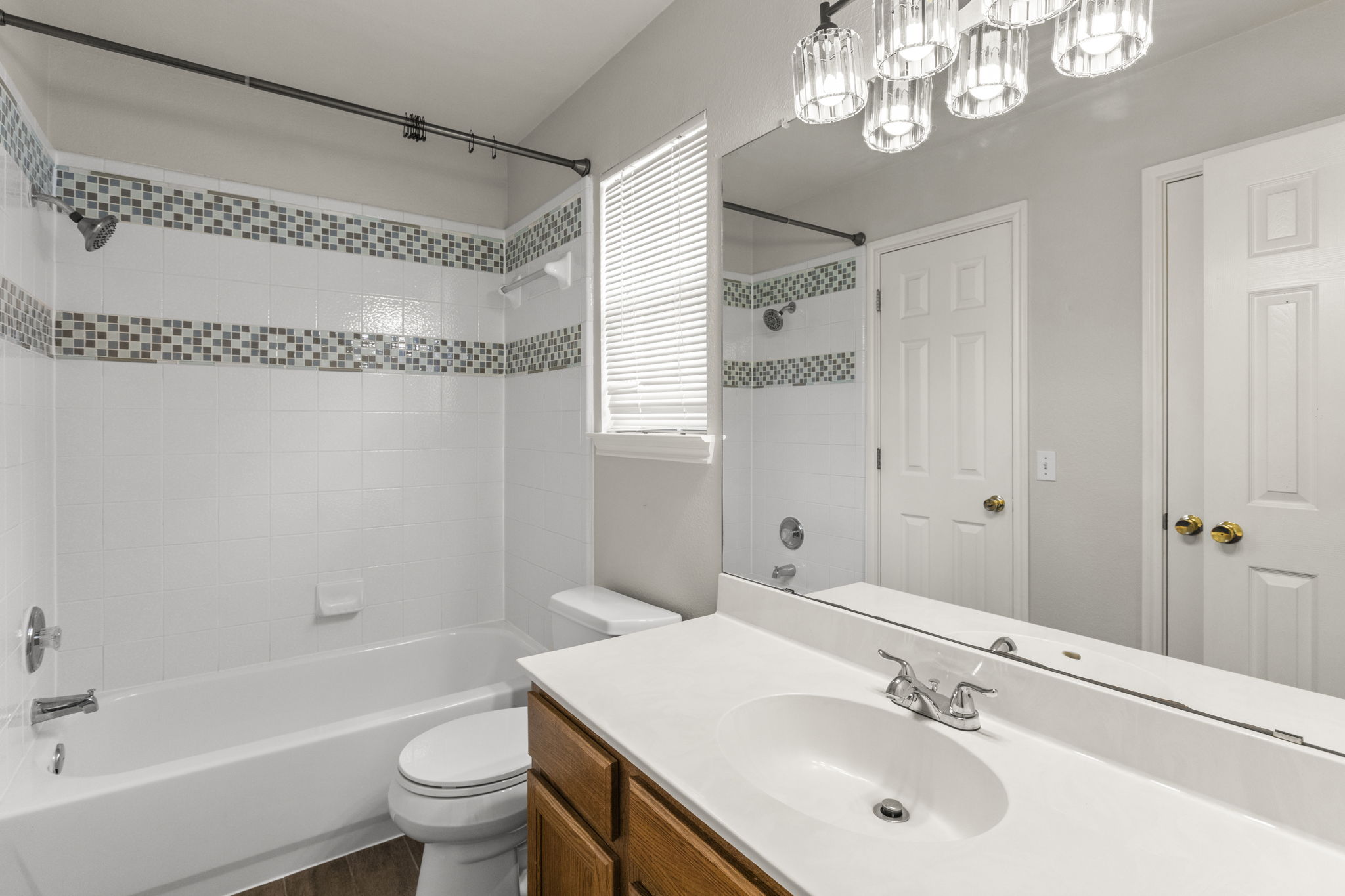 1100 Vanderbilt Circle Pflugerville, TX 78660 - Photo 30 of 39 a bathroom with a sink a toilet a mirror and shower