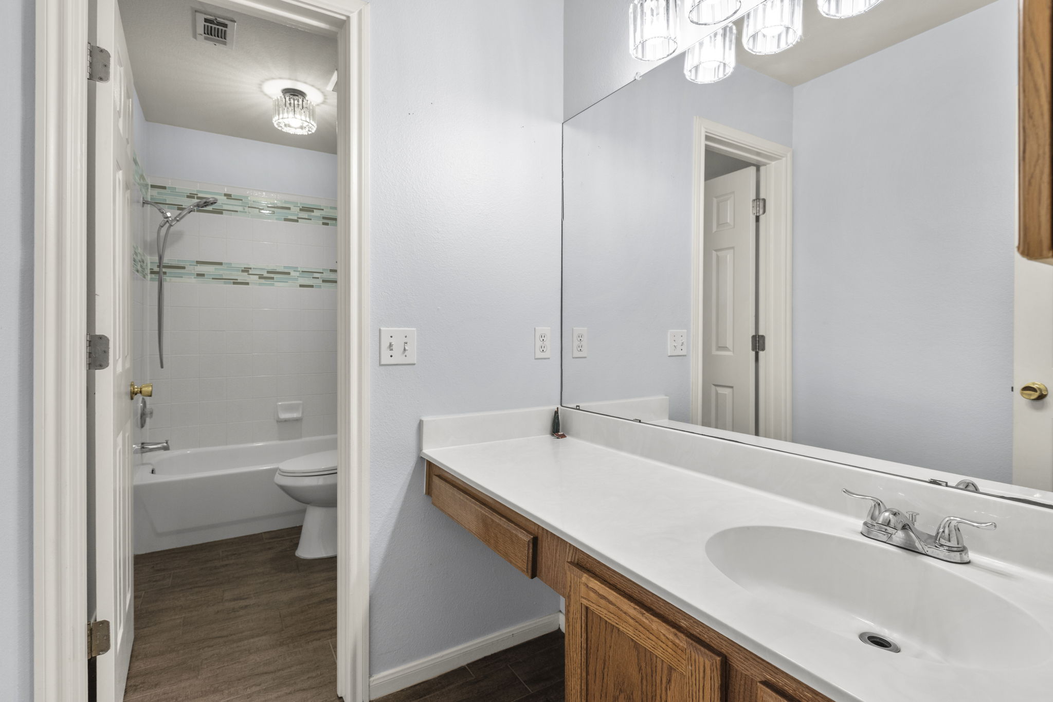 1100 Vanderbilt Circle Pflugerville, TX 78660 - Photo 32 of 39 a bathroom with a sink a toilet and shower