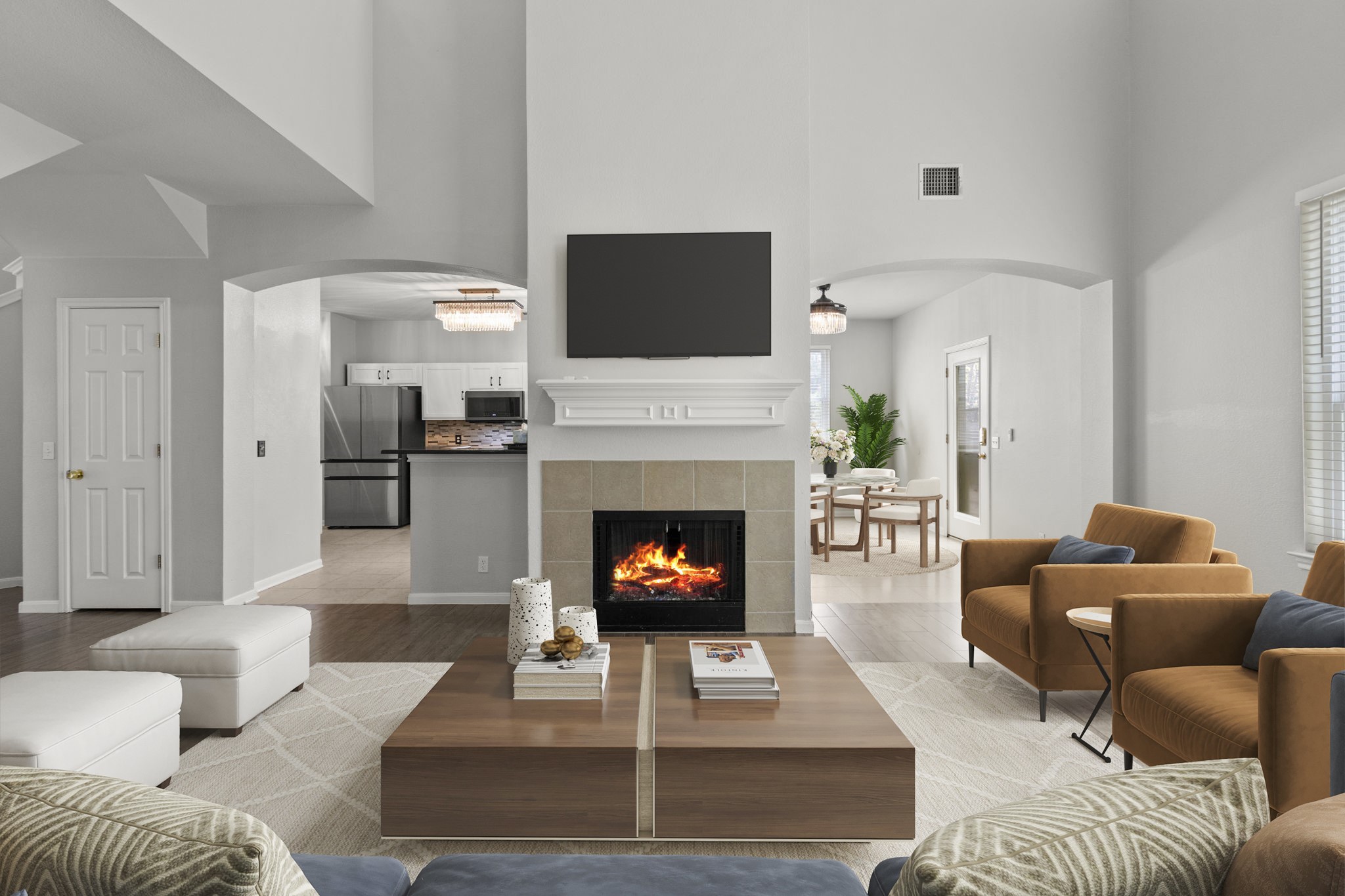 1100 Vanderbilt Circle Pflugerville, TX 78660 - Photo 8 of 39 a living room with furniture a flat screen tv and a fireplace