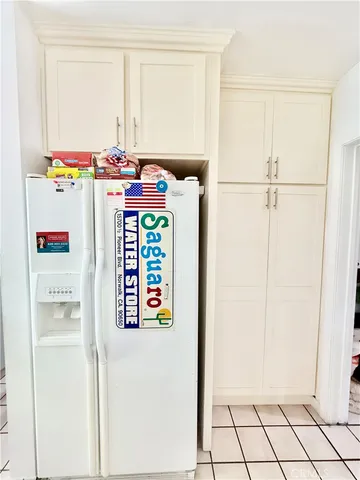 a view of a patio with a table and chairs