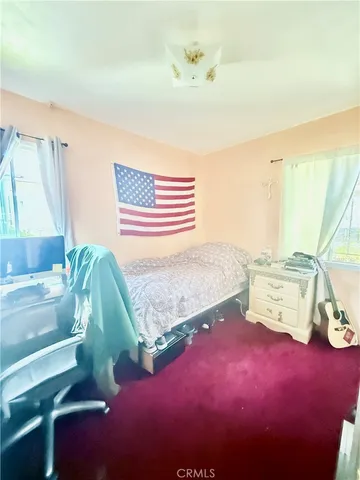 a spacious bathroom with a granite countertop sink a toilet and a shower