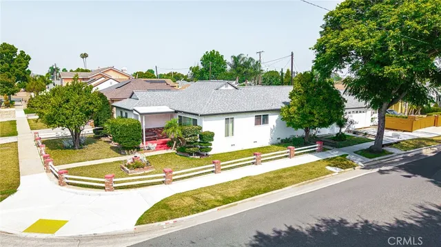 an aerial view of a house with a garden and mountain view