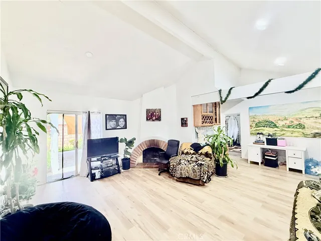 a kitchen with stainless steel appliances a refrigerator sink and cabinets