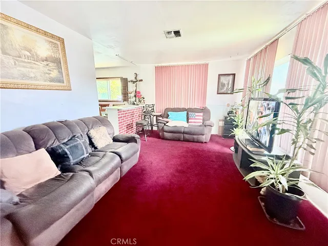 a kitchen with stainless steel appliances white cabinets and a stove top oven