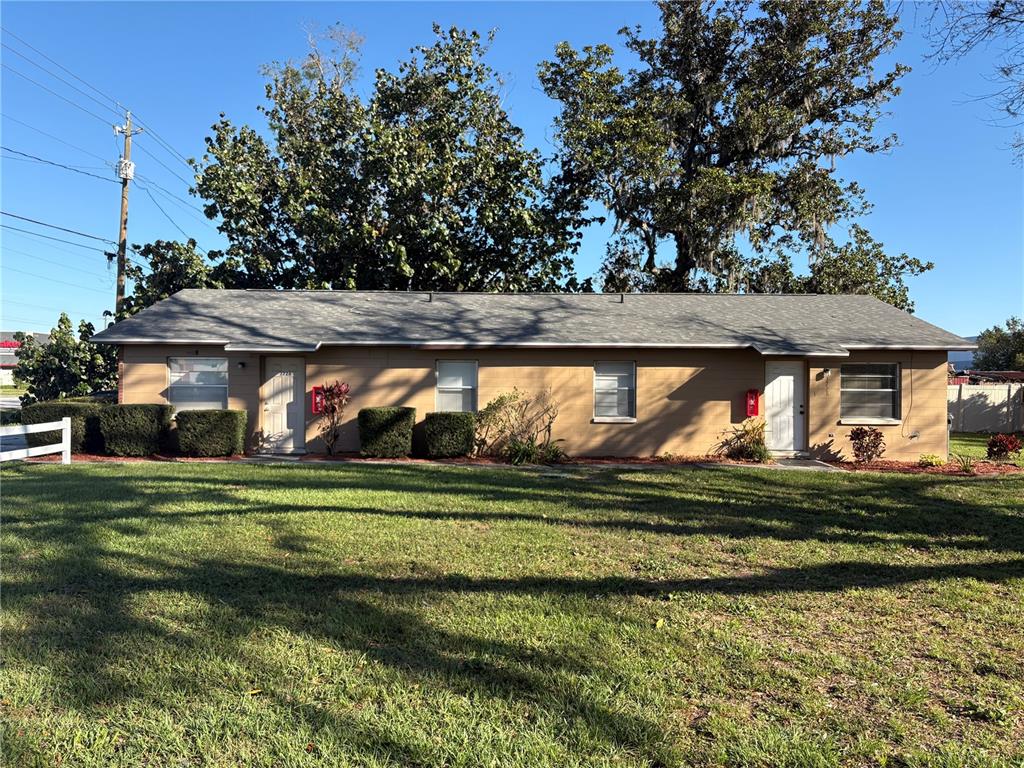 3726 County Line Road Lakeland, FL 33811 - Photo 1 of 1 a front view of a house with a yard table and chairs