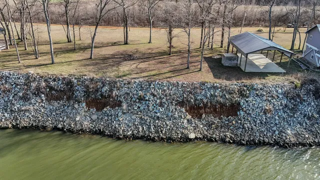 a view of a backyard with sitting area
