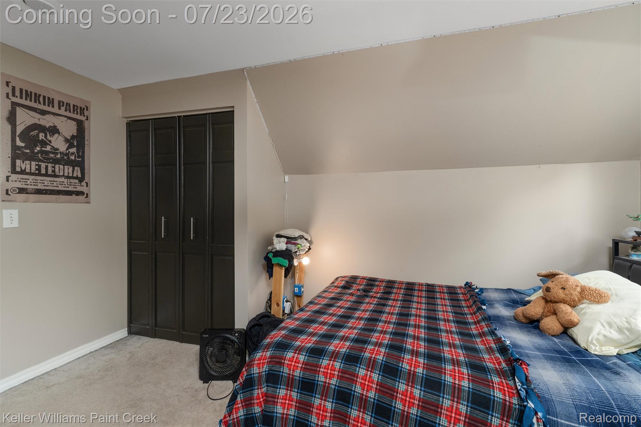 2611 Quail Run Street Rochester, MI 48306 - Photo 21 of 48 Bedroom featuring a paneled bi-fold closet, neutral carpeting, and sloped ceiling