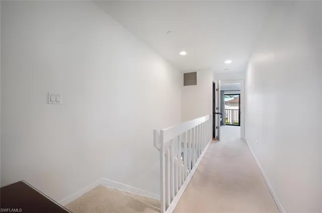 a view of a hallway with closet