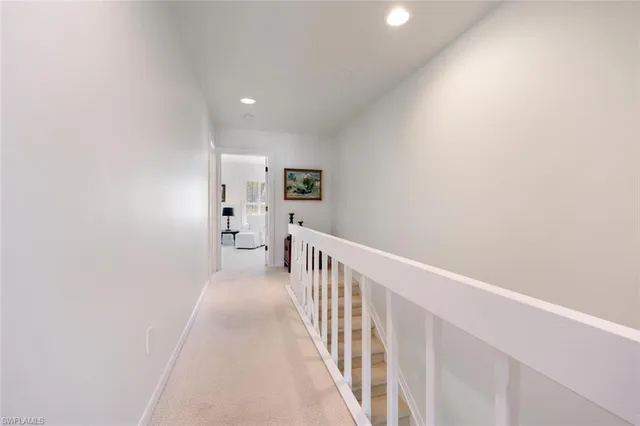 a view of a hallway with a white walls