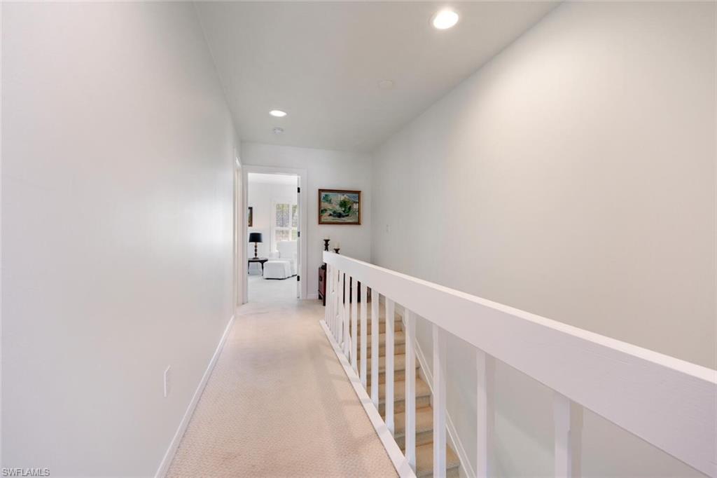 1080 6th Street South Naples, FL 34102 - Photo 21 of 33 a view of a hallway with a white walls
