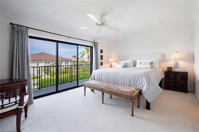 a spacious bedroom with a bed and a large window