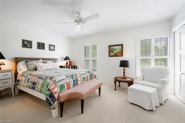 a spacious bedroom with a bed and a couch