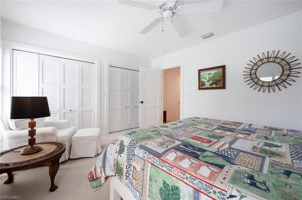 1080 6th Street South Naples, FL 34102 - Photo 29 of 33 a bedroom with a bed and a table