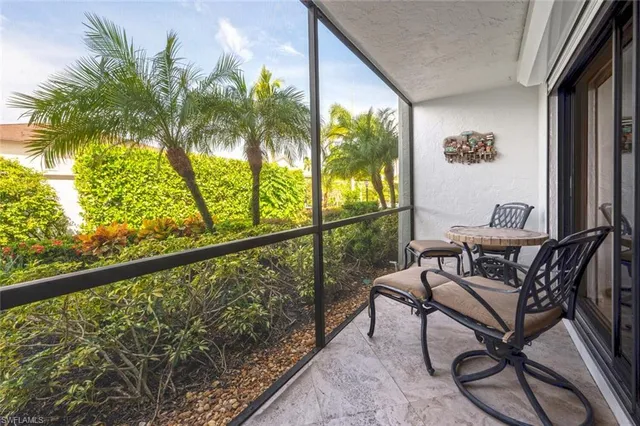 a view of swimming pool with outdoor seating