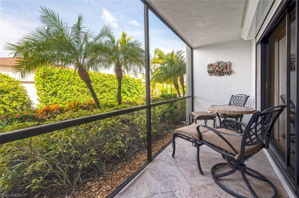 1080 6th Street South Naples, FL 34102 - Photo 31 of 33 a view of swimming pool with outdoor seating
