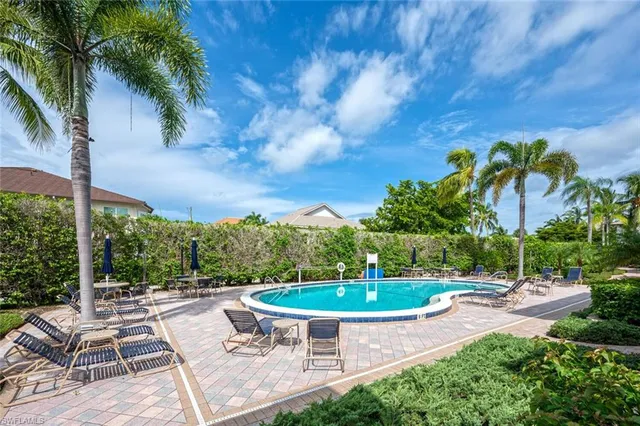 a view of a swimming pool with a patio