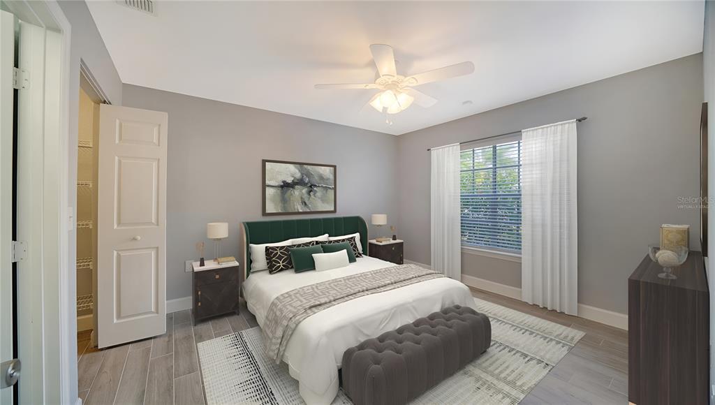 8923 Manor Loop, Unit 106 Lakewood Ranch, FL 34202 - Photo 3 of 36 This photo has been virtually staged. Primary bedroom with lake view.