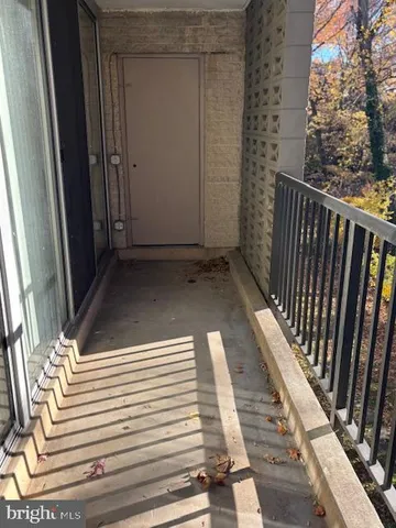 a view of balcony with wooden floor