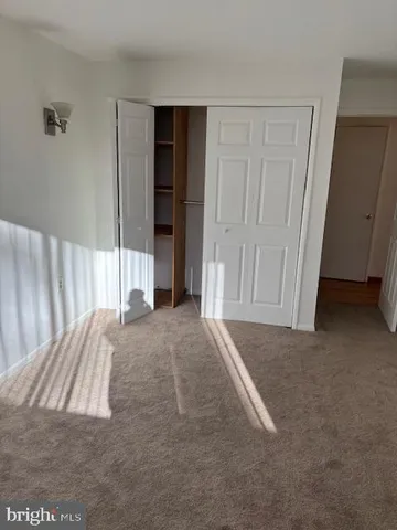 a view of empty room with floor to ceiling window