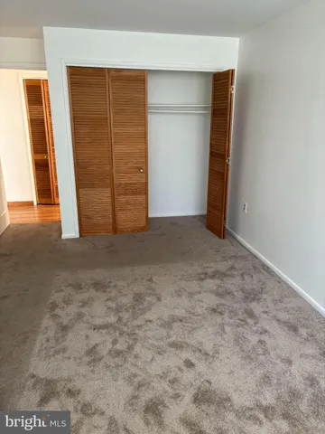 an empty room with walk in closet