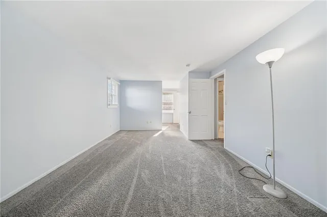 a view of an empty room with a closet