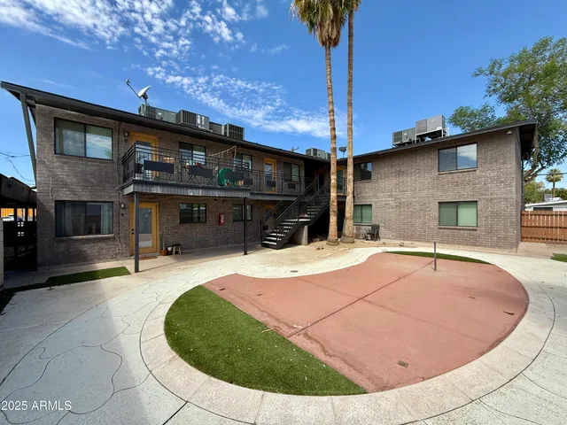 a view of a house with basketball court