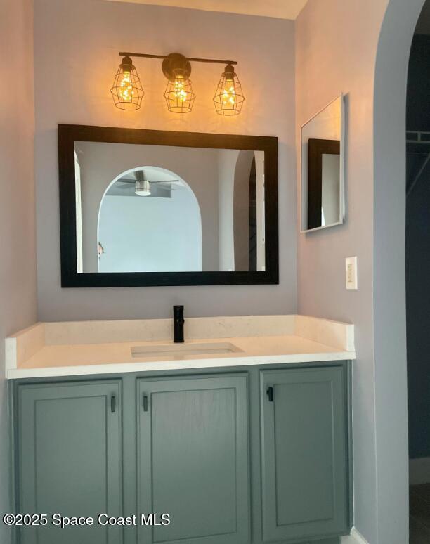 2226 Redwood Circle Palm Bay, FL 32905 - Photo 20 of 27 a bathroom with a sink and a mirror