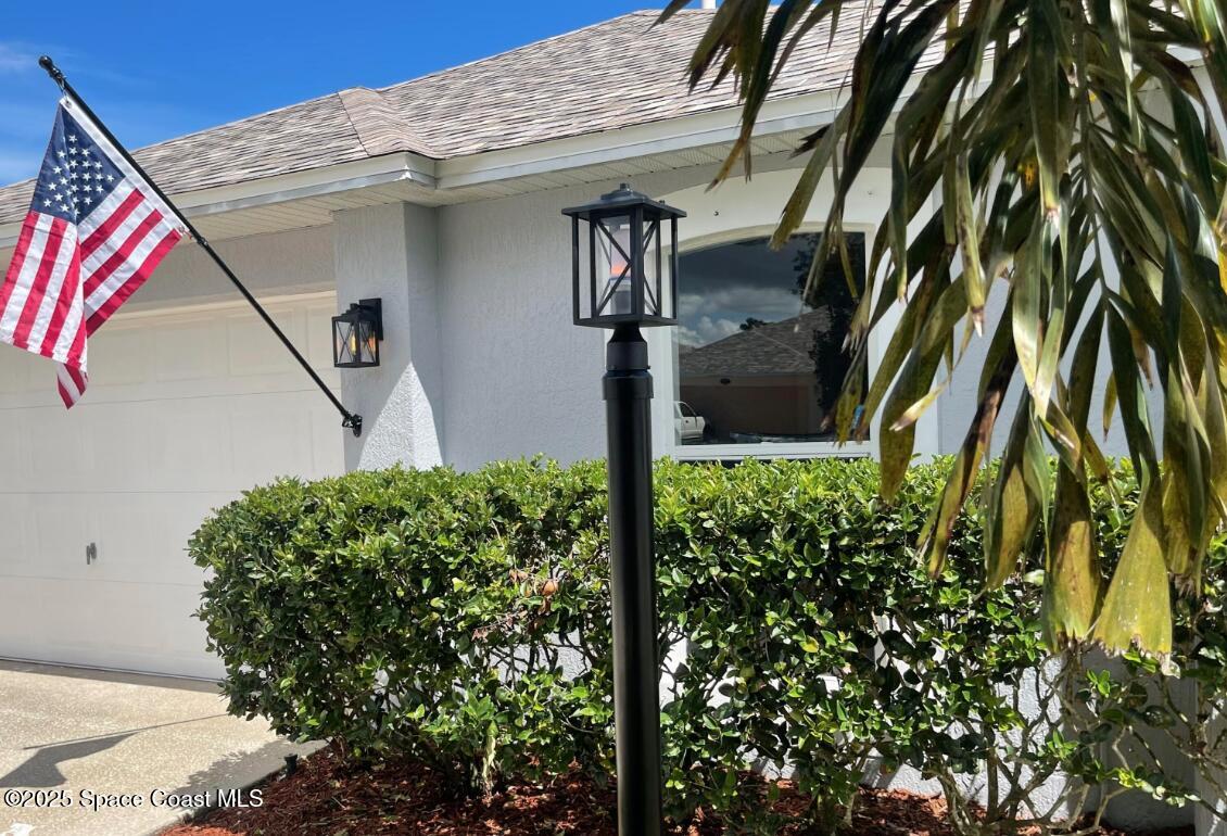 2226 Redwood Circle Palm Bay, FL 32905 - Photo 5 of 27 a front view of a house with a yard