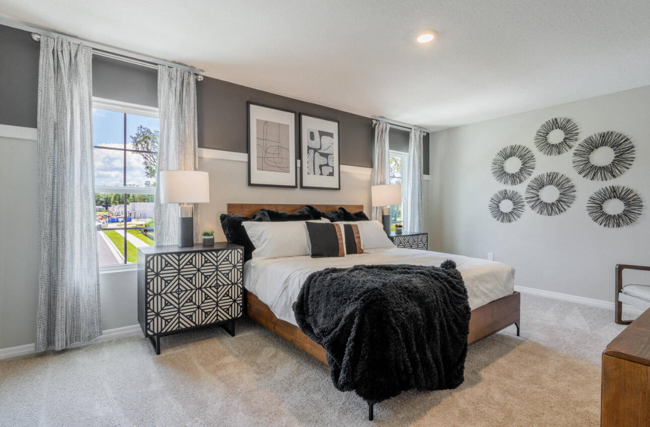 12276 Nettuno Way Port St. Lucie, FL 34987 - Photo 14 of 21 a spacious bedroom with a bed and a couch