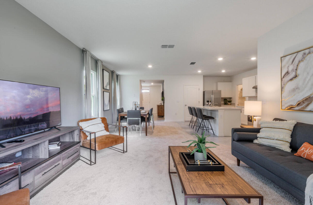 12276 Nettuno Way Port St. Lucie, FL 34987 - Photo 21 of 21 a living room with furniture and a flat screen tv