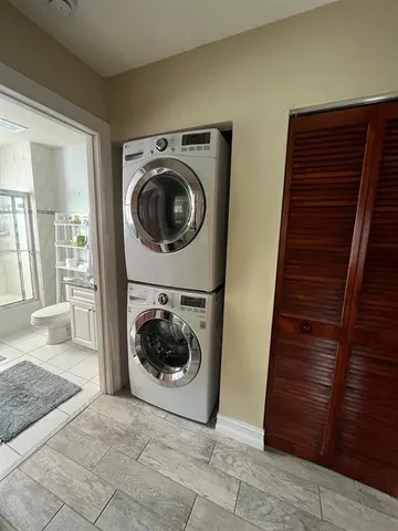 a view of a hallway with washer and dryer