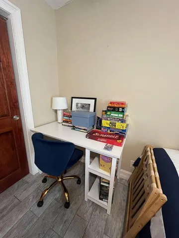 a room with furniture and a wooden floor