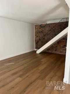 a view of balcony with wooden floor