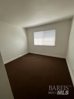 a view of a hallway with a white door