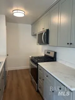 a kitchen with a stove and a microwave