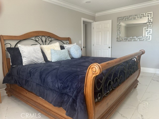 17289 Armintrout Drive Riverside, CA 92504 - Photo 23 of 30 a bed sitting in a bedroom next to a window