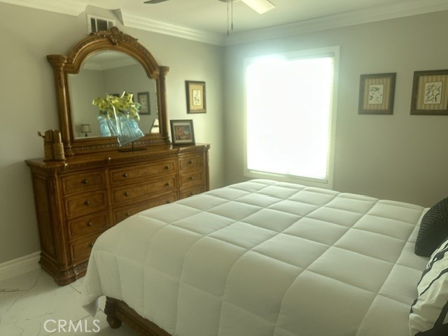 17289 Armintrout Drive Riverside, CA 92504 - Photo 25 of 30 a bedroom with a bed and a mirror on dresser