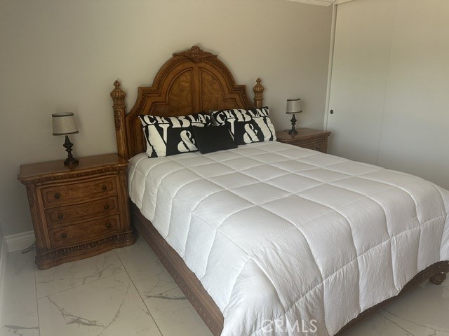 17289 Armintrout Drive Riverside, CA 92504 - Photo 26 of 30 a bedroom with a bed and a dresser