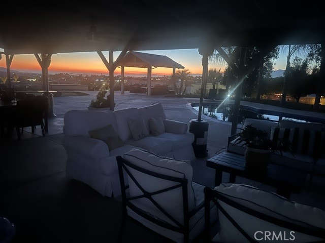 17289 Armintrout Drive Riverside, CA 92504 - Photo 7 of 30 a outdoor living space with patio couch and a fireplace